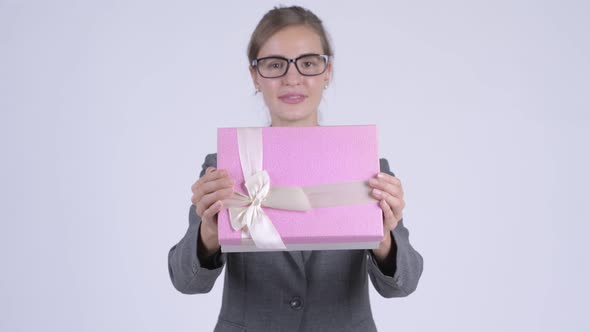 Young Happy Businesswoman Giving Gift Box
