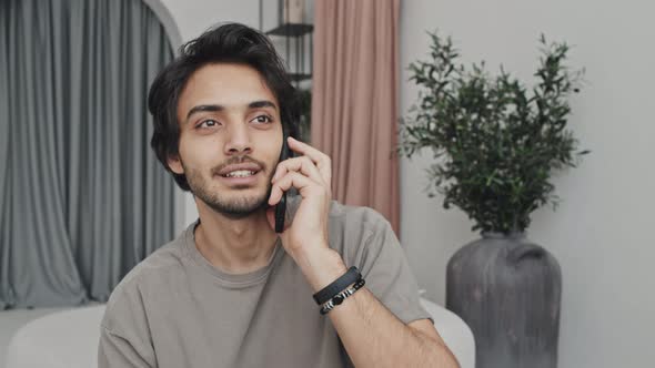 Manager Talking on Phone at Home