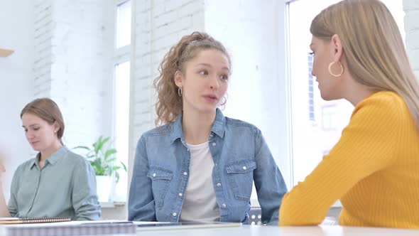 Young Female Designers Having Discussion in Office