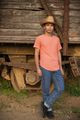 Placeit - Mexican Young Man Posing in Front of a Wooden Old Train Wagon - PhotoDune Item for Sale
