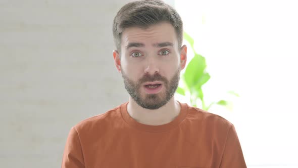 Excited Young Man Reacting to Success