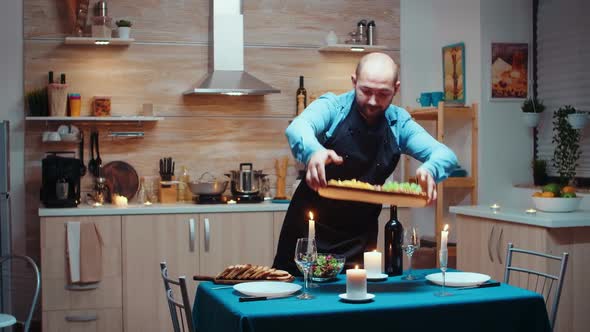 Delighted Man Preparing Romantic Dinner