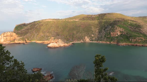 A beautiful summers day overlooking the Knysna HEads from a viewpoint with boats coming in and out o