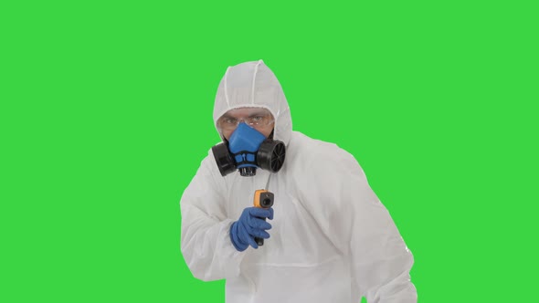 Virologist Checks Temperature with an Infrared Thermometer James Bond Parody on a Green Screen