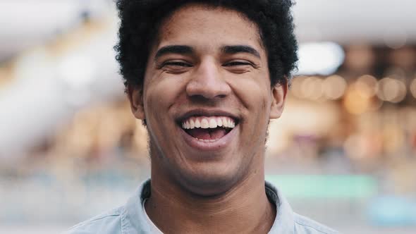 African American 30s Man Looking at Camera Having Wide Sincere Toothy Smile Dental Concept Laughing