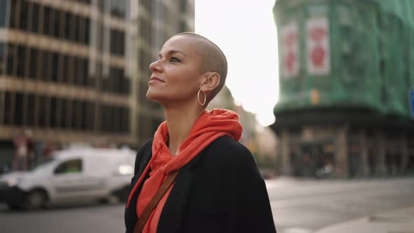 Happy bald woman walking