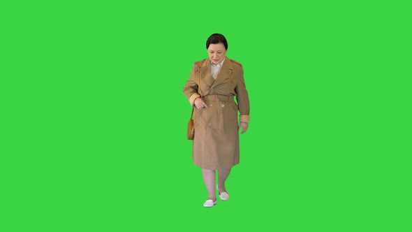 Thick Brunette Woman in a Trench Coat Walking on a Green Screen Chroma Key