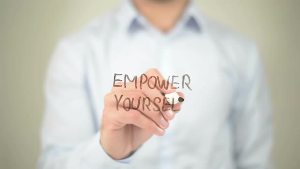 Empower Yourself, Businessman Writing on Transparent Screen