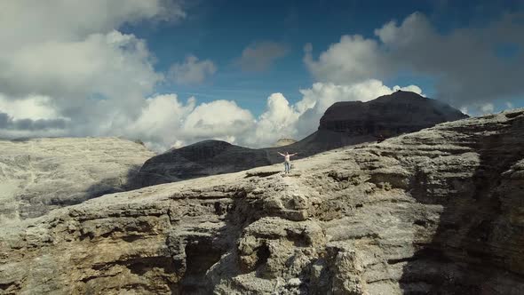 Aerial View of Happy Woman Reaching the Top of Piz Boe Mountain