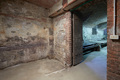 Old, empty basement with brick walls and wooden portal - PhotoDune Item for Sale