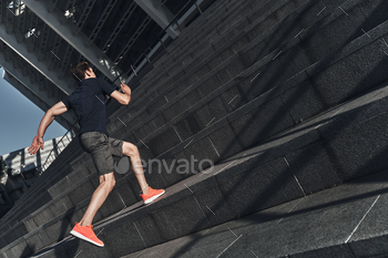 sports clothing running up the stairs while exercising outside