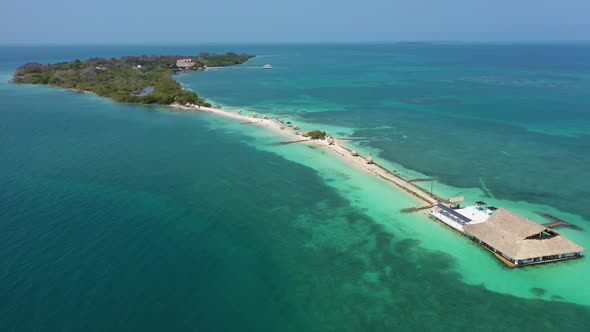 Beautiful Beach with White Sand Turquoise Ocean Blue Sky on a Sunny Day Aerial View