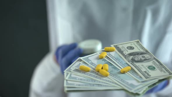 Scientist Dropping Pills on Dollars, Expensive Medicine, Pharmaceutical Business