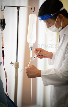 Doctors are treating patients infected with COVID-19, during examination in hospital room / Photodune, Misc