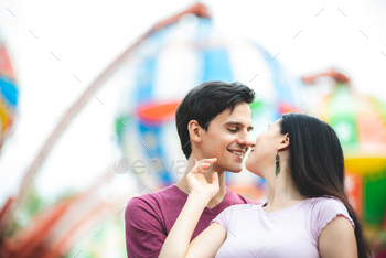 romantic lover couple embracing hug at amusement park, dating at theme park / Photodune, Misc