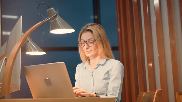 Saleswoman Analyzing Charts On Laptop. Focused Trader Reading Corporate Financial Audit.