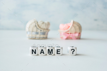 ative straw cradles with thread hearts and text name? on light background