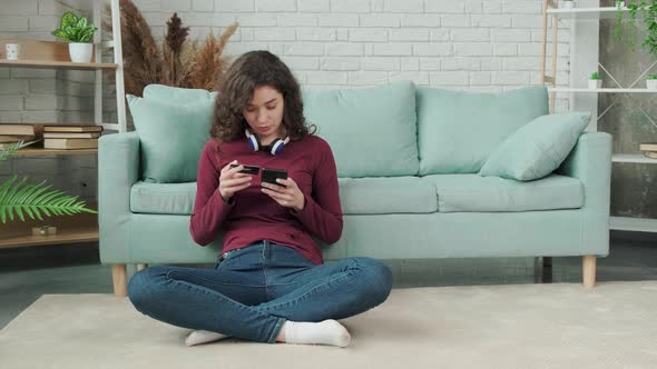 Young Woman Shopping Online with Credit Card Using Smart Phone at Home