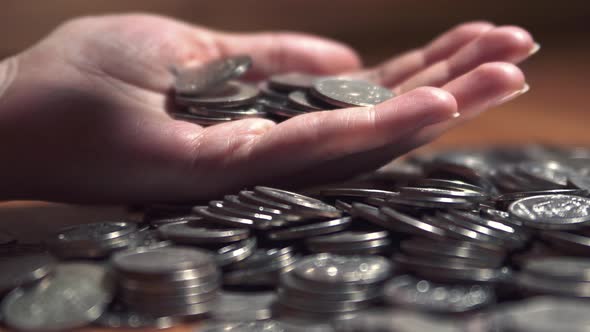 women's hands count coins