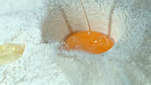 Super Slow Motion Shot of Falling Egg Into Flour at 1000Fps