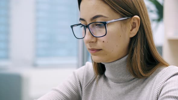 Beautiful Woman, Office Worker Using Laptop at Office. Female Freelance, Manager.