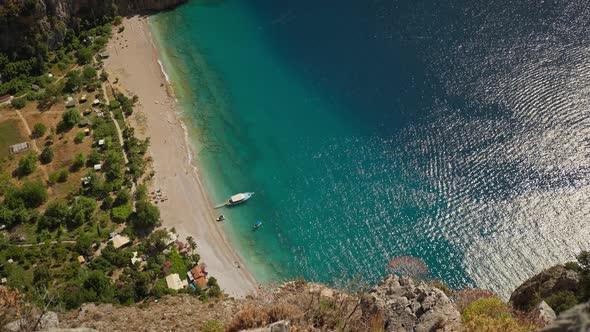 Aerial Top Down View of the Turquoise Blue Water at Butterfly Valley with Large Tourist Boats