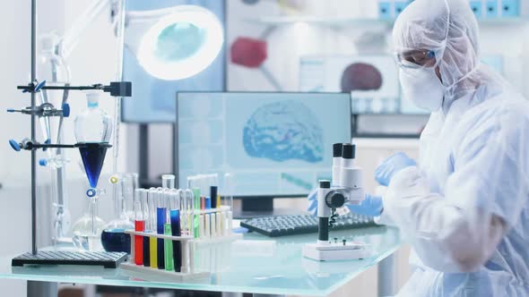 Male Scientist Researcher Working in a Secure High End Laboratory alt