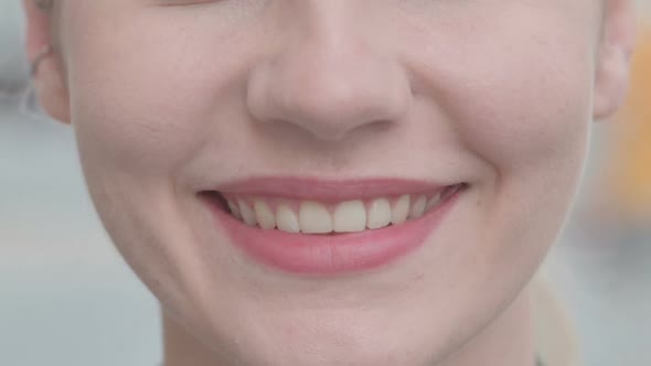Close up of Female Smiling Lips Outdoor