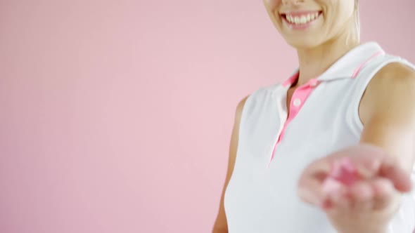 Portrait of woman holding ribbon