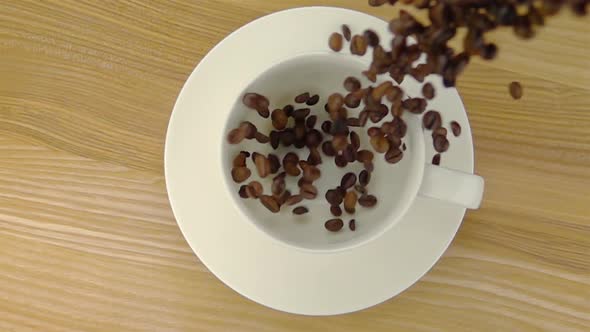 Whole Coffee Beans  Falling into the Cup