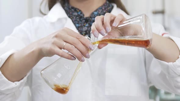 Slow Motion of Female Scientist Analyzes Liquid in Distillery Laboratory Researcher. Slow Motion of