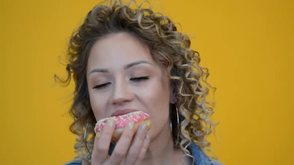 Beautiful Girl Eating Fresh Donut