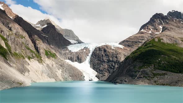 The glacier the lake and the mountains during the day