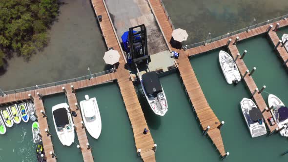  Aerial View on Boat Loader Launching the Yacht From the Ramp at Miami Harbor alt