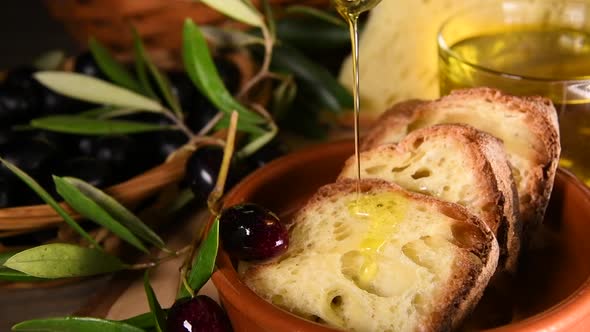 Olive oil is pouring on A whole grain weat bread