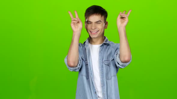 Male Actor Smiles, Showing Them Different Grimaces and Language. Green Screen