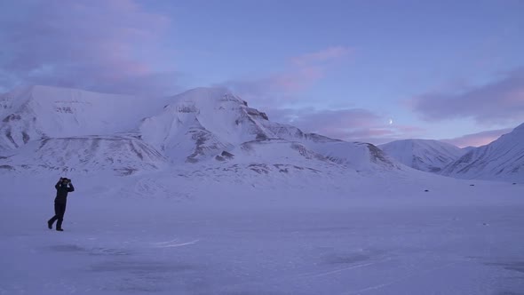 A Lost Lonely Traveler Goes Through a Snowstorm in Svalbard