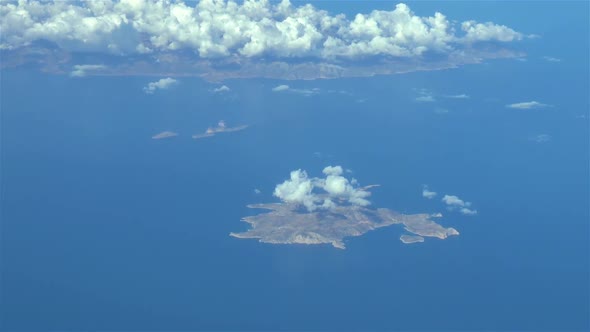 Aircraft flies over the Greek Islands. Actual high altitude airplane footage. Cockpit view