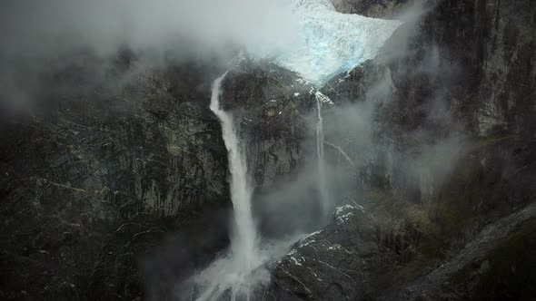 Aerial view of misty waterfall in Cisnes, Region de Aysen, Chile.