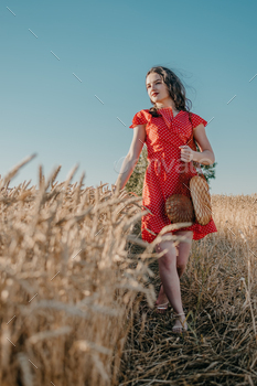 esources, Reduce consumption, Sustainable Lifestyle. Young brunette woman in rustic dress walking along village road with mesh bag and Homemade Bread.