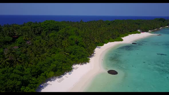 Aerial drone landscape of relaxing island beach voyage by transparent lagoon with white sand backgro