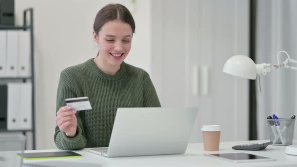 Young Woman Online Payment Success on Laptop 