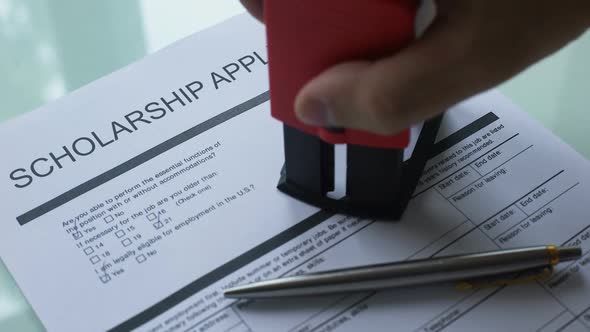 Scholarship Application Document Rejected, Hand Stamping Seal on Official Paper