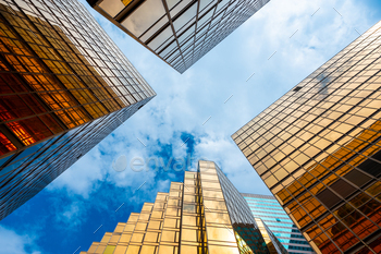 Golden skyscrapper building with blue sky in Hong Kong. Windows glass of modern office / Photodune, Misc