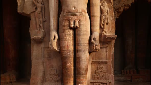 Rockcut Statue of Jain Thirthankara in Rock Niche Near Gwalior Fort. Gwalior, Madhya Pradesh, India