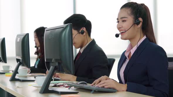 Business People Wearing Headset Working in Office