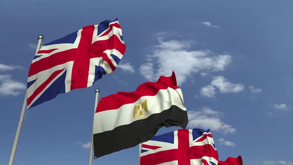 Flags of Egypt and the United Kingdom Against Blue Sky