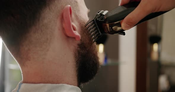 Barber Sets Hair By Spray and Combs Them