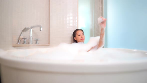 Young asian woman relax in bathtub