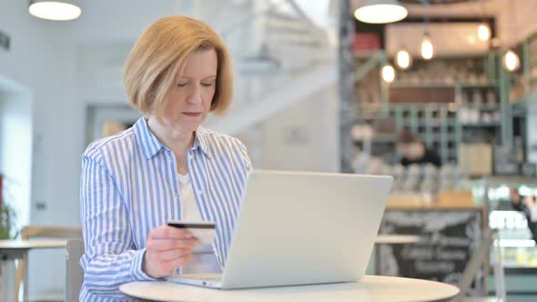 Unsuccessful Online Payment on Laptop By Creative Old Woman